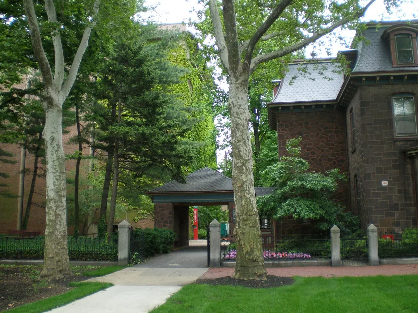 Tree-shaded courtyard entrance at Rutgers Law School in Camden