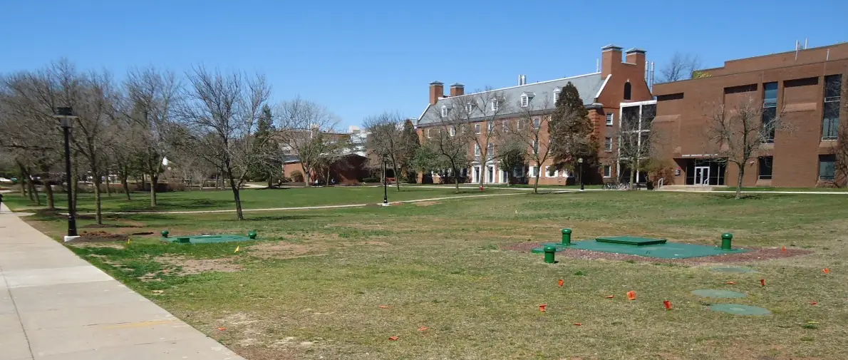Open quadrangle and academic buildings on Rutgers’ Busch Campus